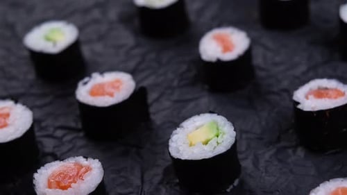 Close up of Sushi Rolls with Salmon and Avocado