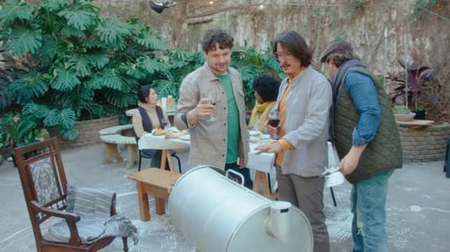 Adults Enjoying a Barbecue in an Urban Setting