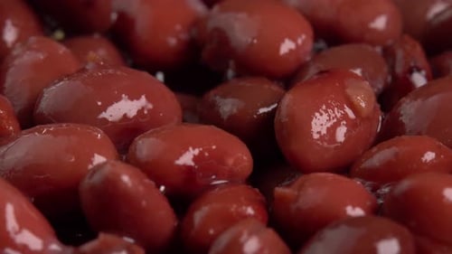 Canned red kidney beans rotating background side view. Organic steamed beans. Pickled beans