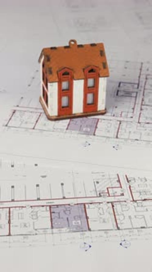House Model and Money on Blueprint