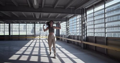 Young Woman Dancing in an Urban Industrial Space