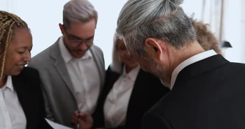 Multiracial business teamwork and financial strategy in modern bank office USA