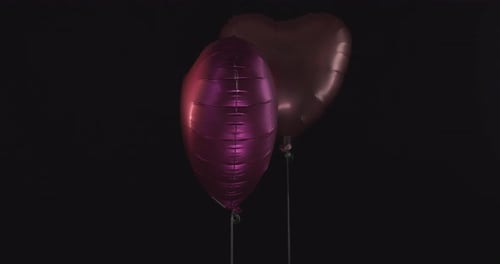 Heart Balloons Floating on Black Background