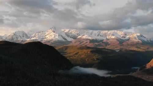 Natural Landscape Snowcapped Mountains and High Hills Drone Aerial View of Stunning Mountainscape