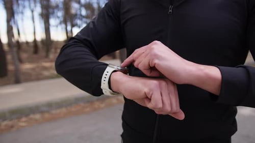 Man Using Smartwatch in the Park