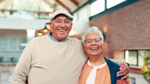 Smiling Senior Couple Embracing Affectionately in Modern Home