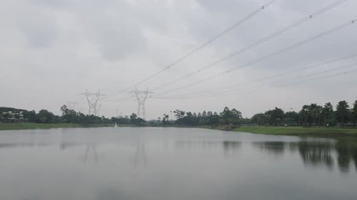 High-voltage Electric Lines Over The Lake. - wide shot