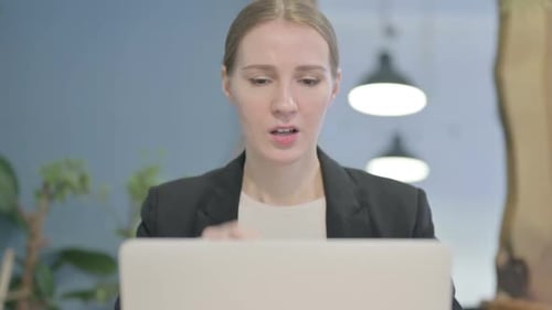 Close Up of Businesswoman having Headache while Working on Laptop