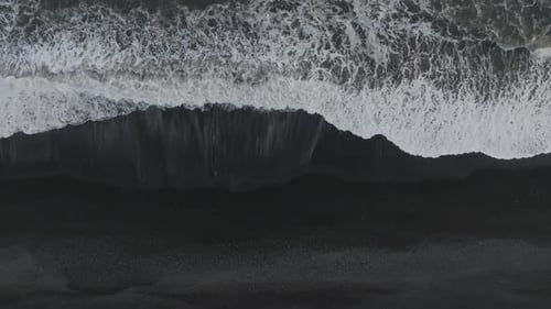 Aerial view of a black sand beach in Iceland.