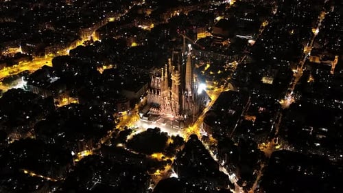 Aerial view of Barcelona Eixample residential district and famous Basilica Sagrada Familia at night