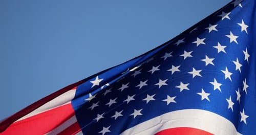 American Flag Waving Against a Blue Sky