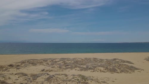 4k moving forward clip over a peninsula on the tropical beach of Epanomi, Halkidiki, Greece
