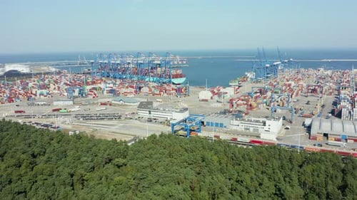 Aerial View of a Logistics Port with a Container Ship