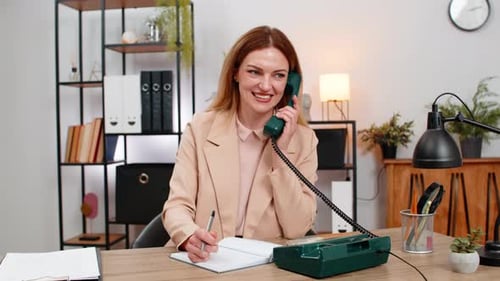 Businesswoman Calls Client on Retro Phone Spins Rotary Dial Takes Notes Agreement Formal Tone Smile