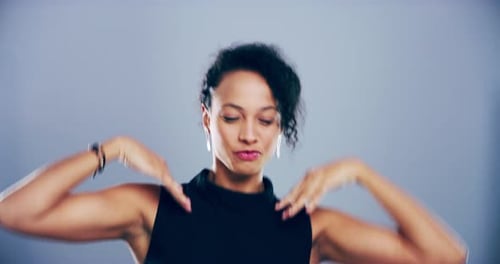 Young Woman Dancing Enthusiastically in Studio Setting