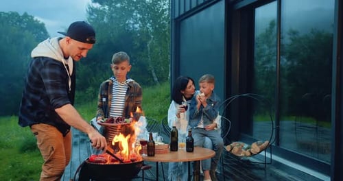 Family Cookout on Porch of Modern Home