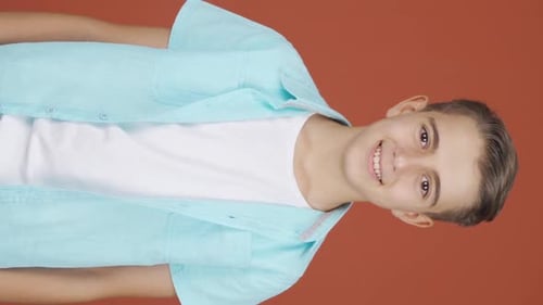 Vertical video of Boy smiling at camera