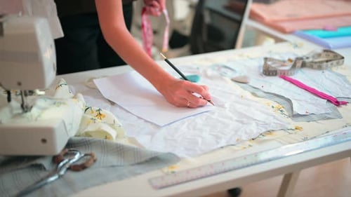 Happy Female Dressmaker Working in Workshop Studio