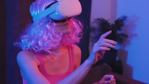 Woman Wearing VR Headset Interacting With Technology
