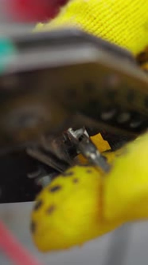 Hands Crimp Terminal onto Red Wire