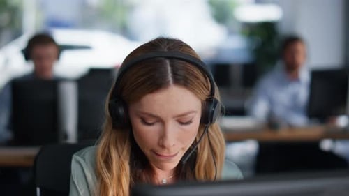 Closeup Service Desk Manager Providing Customer Support in Headset in Office