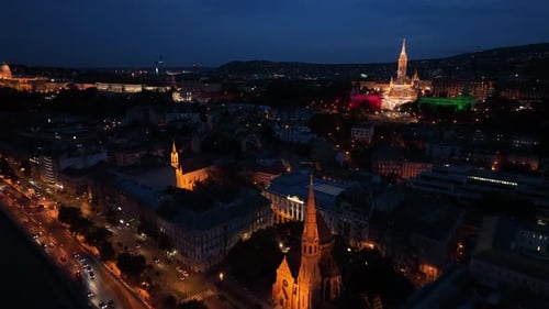Establishing Aerial View Shot of Fisherman’s Bastion and Matthias church at night. Budapest, Hungary