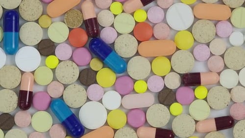 Colorful Pills and Capsules on White Background
