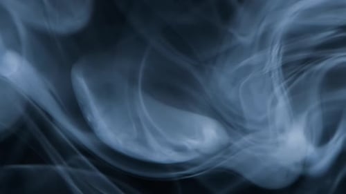 Slow motion of abstract white smoke against black background. Ice smoke cloud. Floating fog.