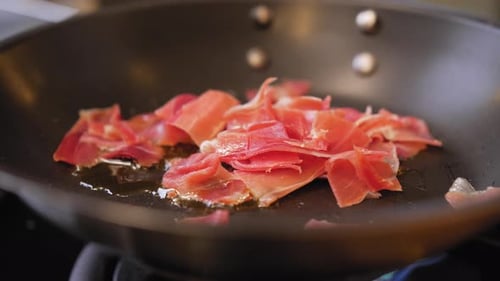 fried ham in a pan close-up