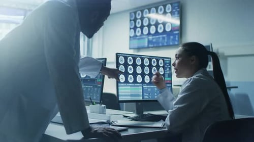 Doctors Analyzing Medical Scans in a Hospital Setting