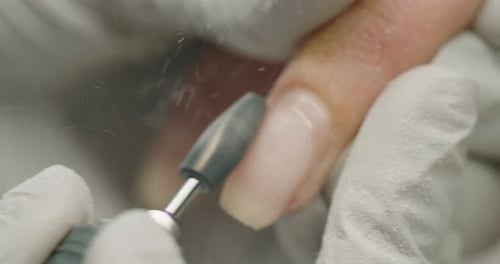 Removing Gel Polish on Fingernails in a Beauty Salon