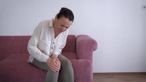 Female with Osteoarthritis Joint Indoor