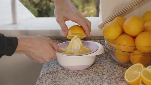 Squeezing Fresh Oranges for Homemade Juice