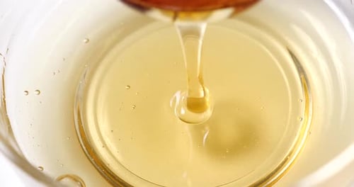 honey drops in a glass
