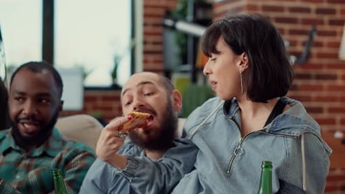 Adult Friends Eating Pizza and Drinking Beer Together