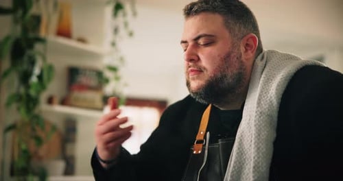 Man Cooking Food in Bright Home Kitchen