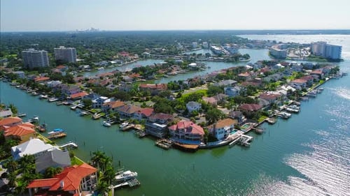 Wide aerial view of Florida luxury neighborhood from the water