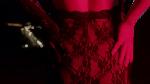 Intense Woman Poses in Black Lace Dress