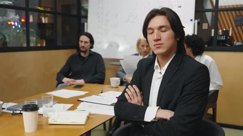 Business People Attending Meeting in Bright Office