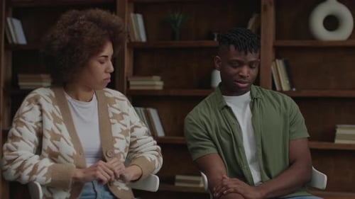 Upset Couple Sitting Together in a Room