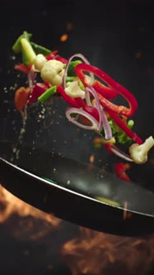 Flying Colorful Vegetables Stir Fried in a Wok