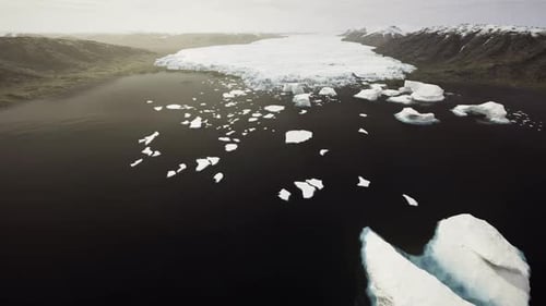 Narrow Passage Filled with Moving Icebergs and Contrasting Waters