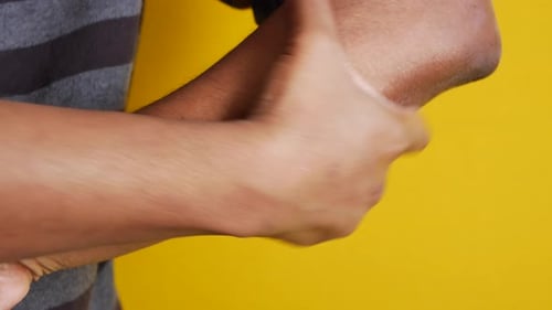 Arm Receives Lotion Application in Close Up Shot