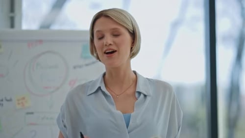 Woman Speaking at Office Meeting