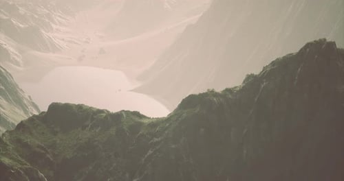 Majestic Mountain Landscape Featuring a Serene Lake During Early Morning Light