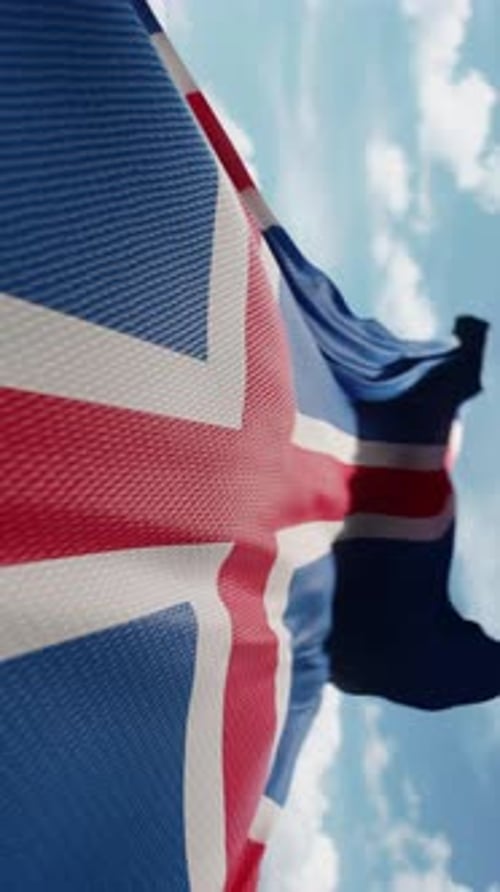 Waving Flag of Iceland Against Blue Sky Vertical Loop