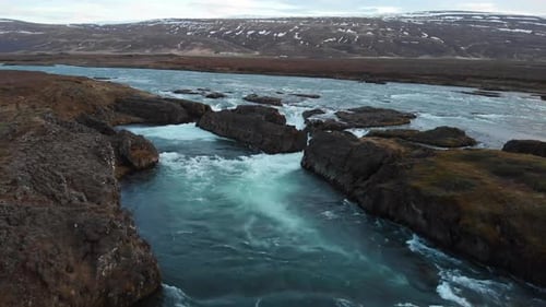 Aerial footage of the mighty Godafoss waterfall located in Iceland. Showing parts of the waterfall a