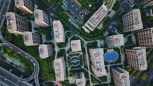 Aerial Top Down View of Modern Residential Area Featuring Greenery Water Features and Recreational