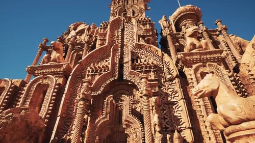 A Beautifully Decorated Temple with Intricate Statues Adorning the Walls