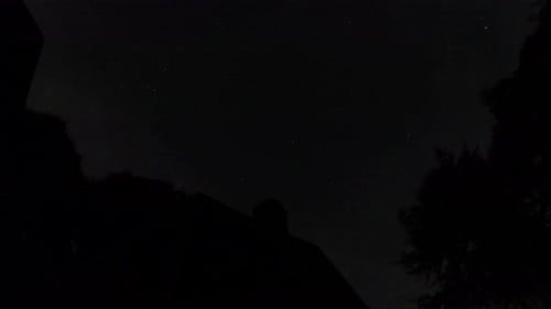 Starry sky nightlapse with house at the Belgian Ardennes